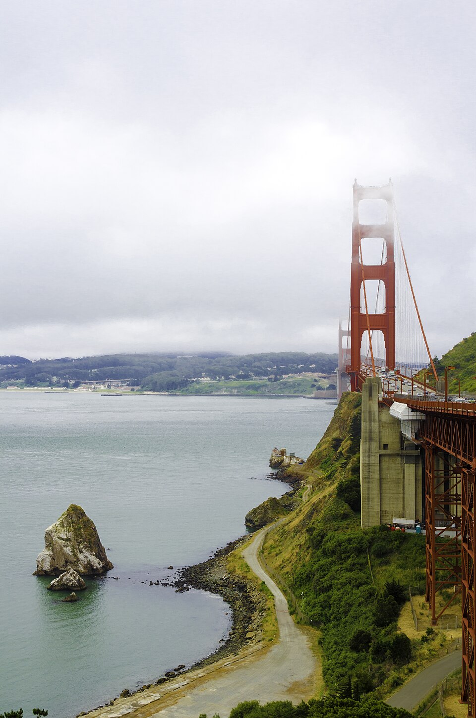 Golden Gate Bridge rising through coastal fog in San Francisco